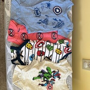 Marvel Baby Onesies in Blue, Red, and Cream